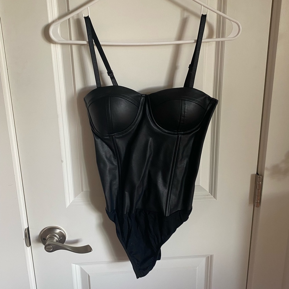 100% Bloomingdale’s Exclusive black faux-leather bodysuit. New with tags!